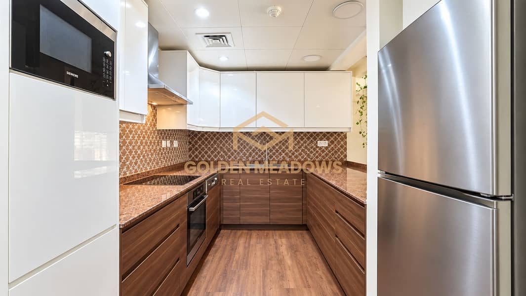 9 Modern U-Shaped Kitchen with Warm Wood Accents. png