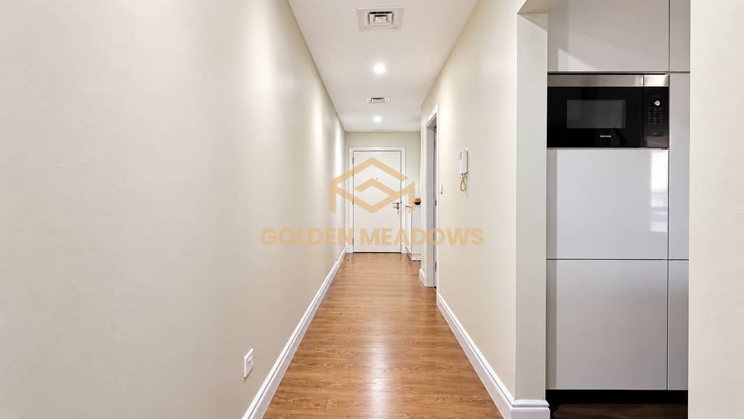 10 Modern Minimalist Hallway with Kitchen Glimpse. png