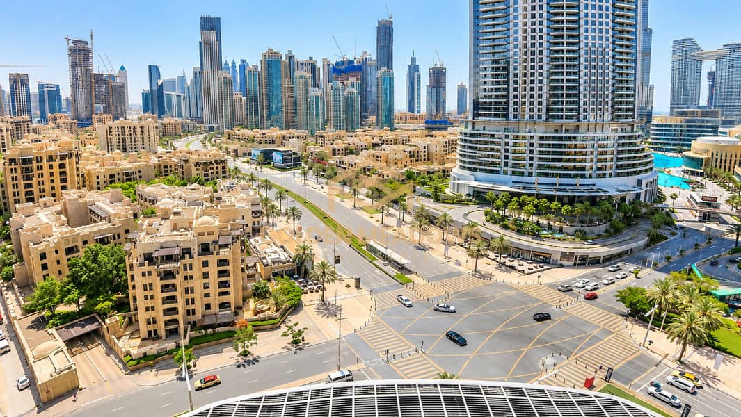 Sunlit Dubai Skyline and Palm-Lined Intersection. png Sunlit Dubai Skyline and Palm-Lined Intersection. png
