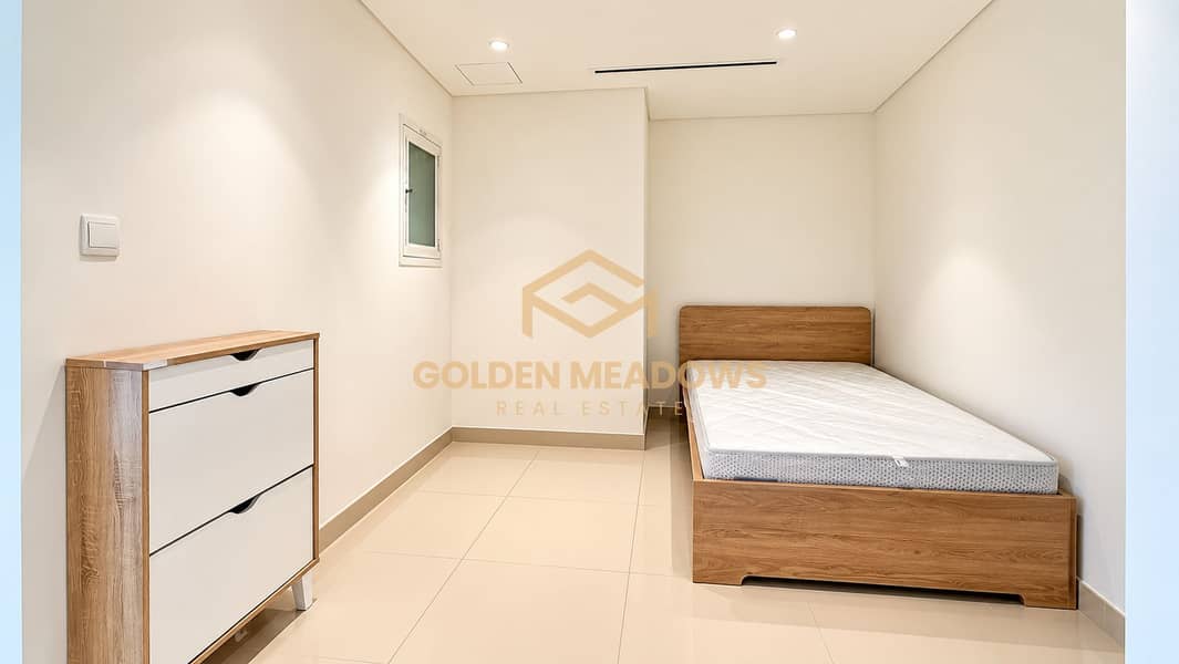 8 Minimalist Bedroom with Oak Bed and Dresser. png