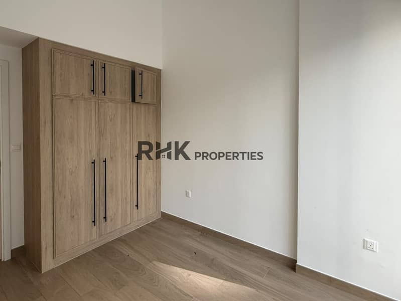 6 Open plan living room and kitchen, Town Square Dubai 1 bed apartment rental