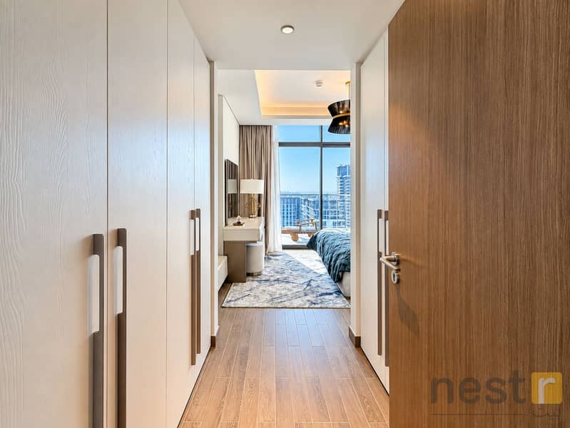 13 Modern Hallway to City-View Bedroom. png
