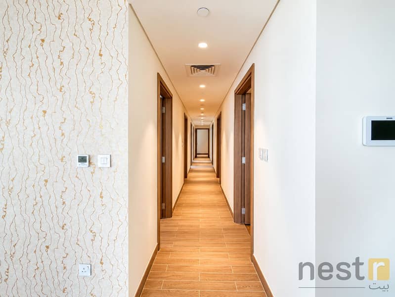 14 Symmetrical Warm Wood Hallway. png
