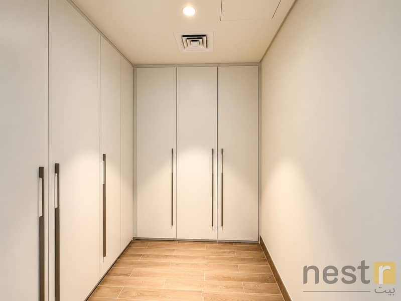 15 Warm Minimalist Walk-In Closet Corridor. png