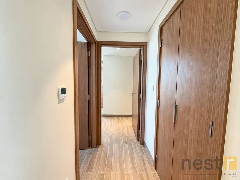 10 Modern Wood-Toned Apartment Hallway. png