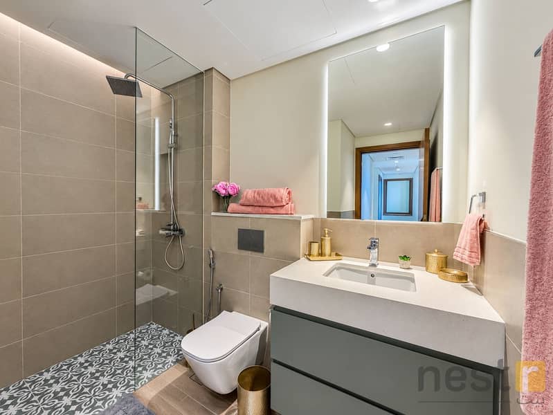 14 Modern Beige Bathroom with Pink Accents. png