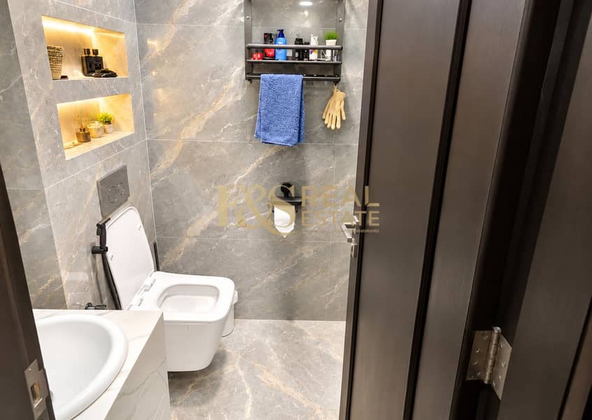 8 Modern Marble Bathroom with Warm Shelves. png