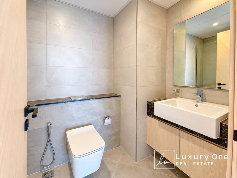 7 Modern Beige-Tiled Bathroom Retreat (1). png