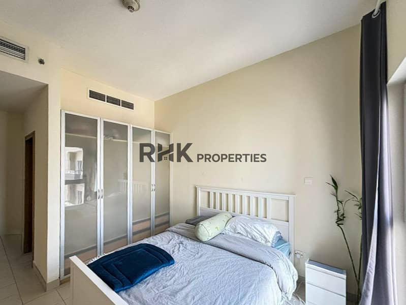 6 Bright apartment bedroom with double bed, mirrored wardrobe, dresser and large window