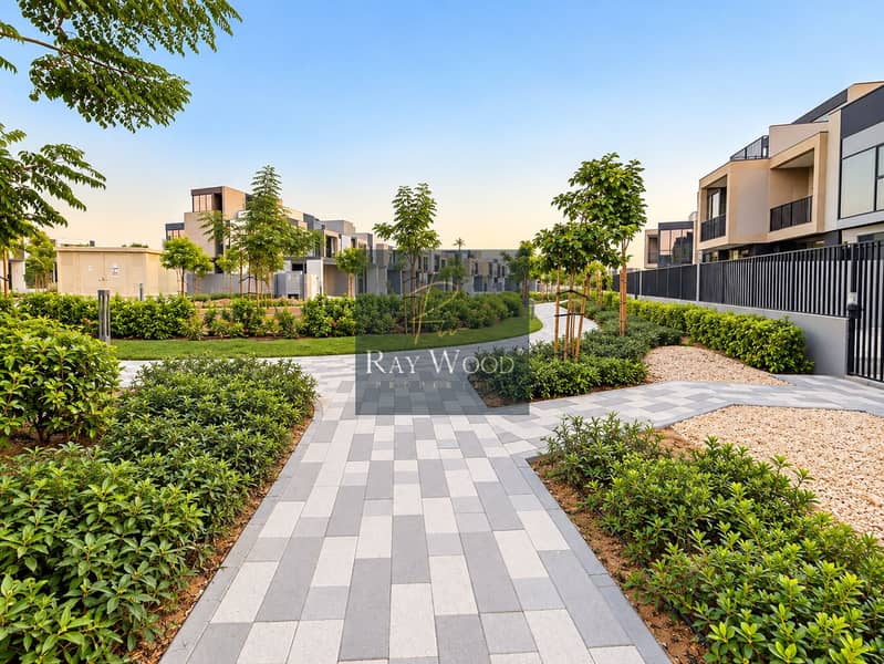 7 Modern Villas Along a Landscaped Walkway. png