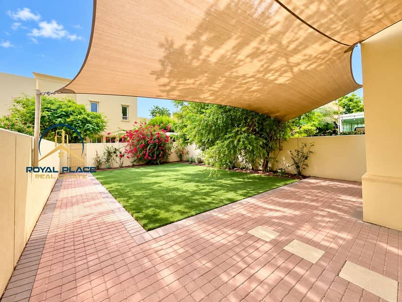3 Sunny Backyard Patio with Shade Sail. png