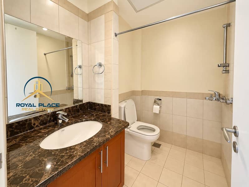 8 Modern Beige Bathroom with Chrome Fixtures. png