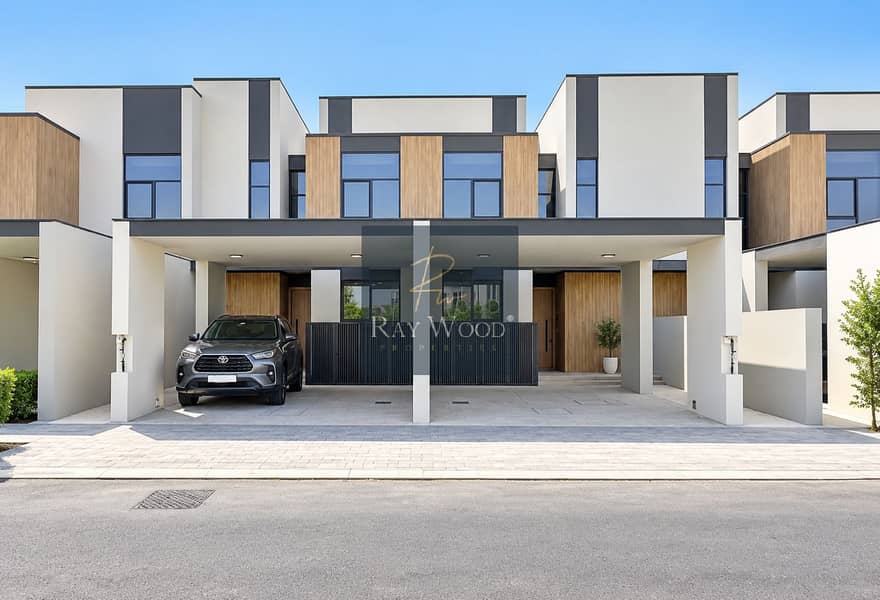 2 Modern Townhouse Facade with Toyota SUV. png