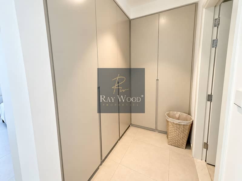 11 Minimalist Greige Walk-In Closet. png