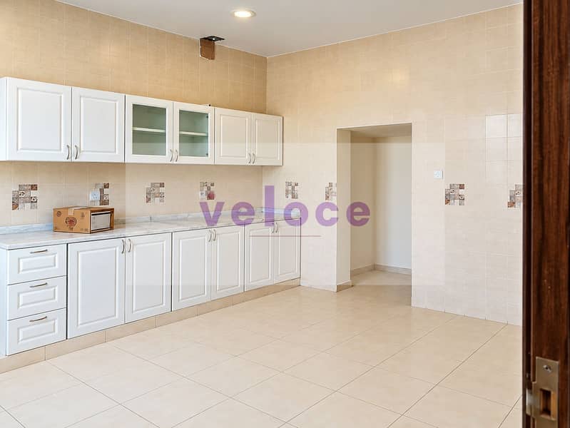 3 Bright Modern Beige-Tiled Kitchen Interior. png