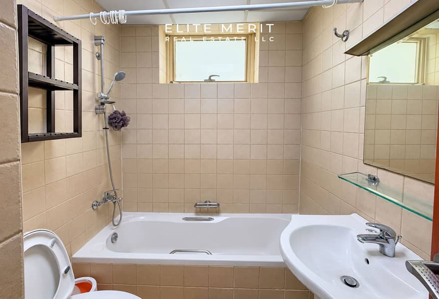 6 Clean Beige-Tiled Bathroom Interior. jpg