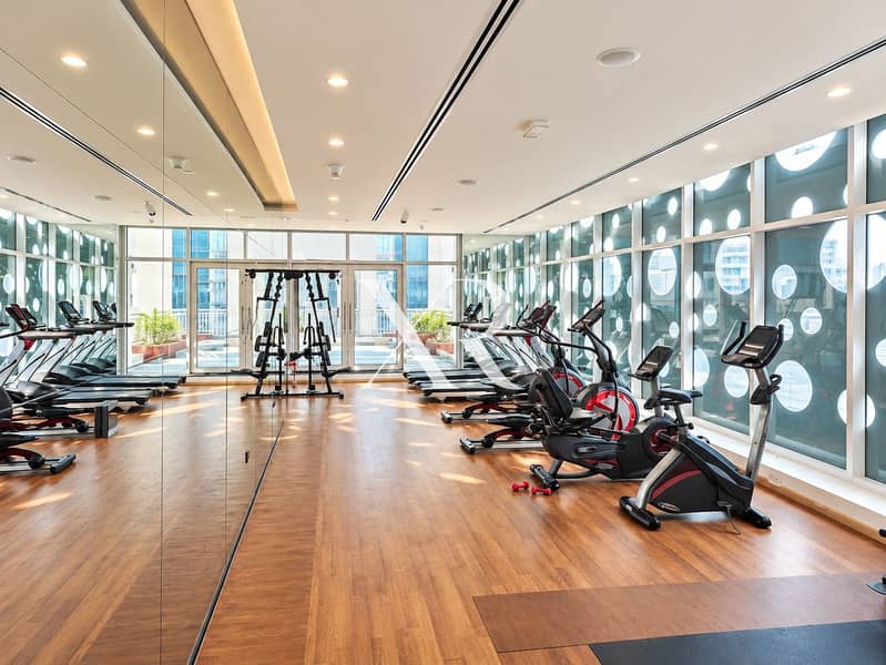 8 Modern Luxury Gym with Circular Windows. png