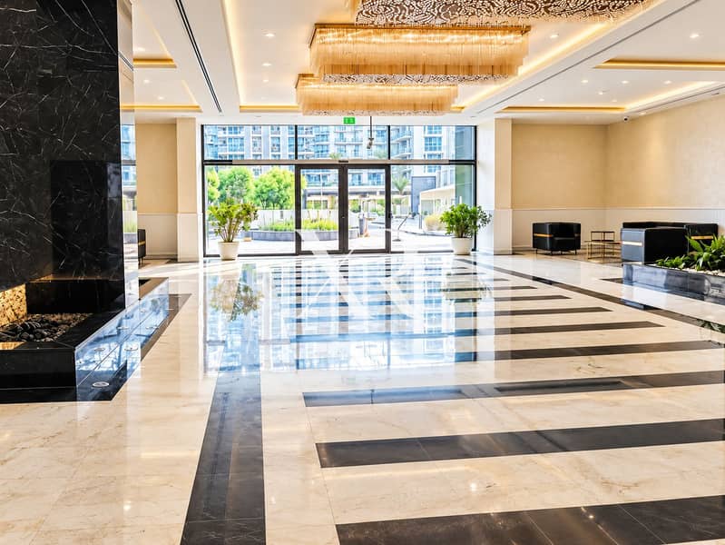 6 Luxury Lobby with Marble Reflections and Garden Views. png