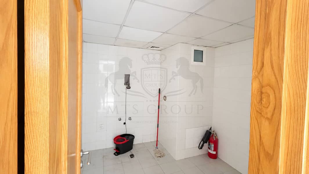 29 Clean Utility Room with Mop Bucket. png