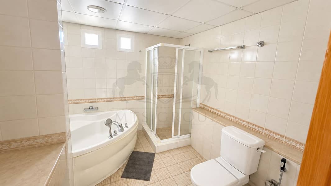 34 Bright Modern Beige Tiled Bathroom. png