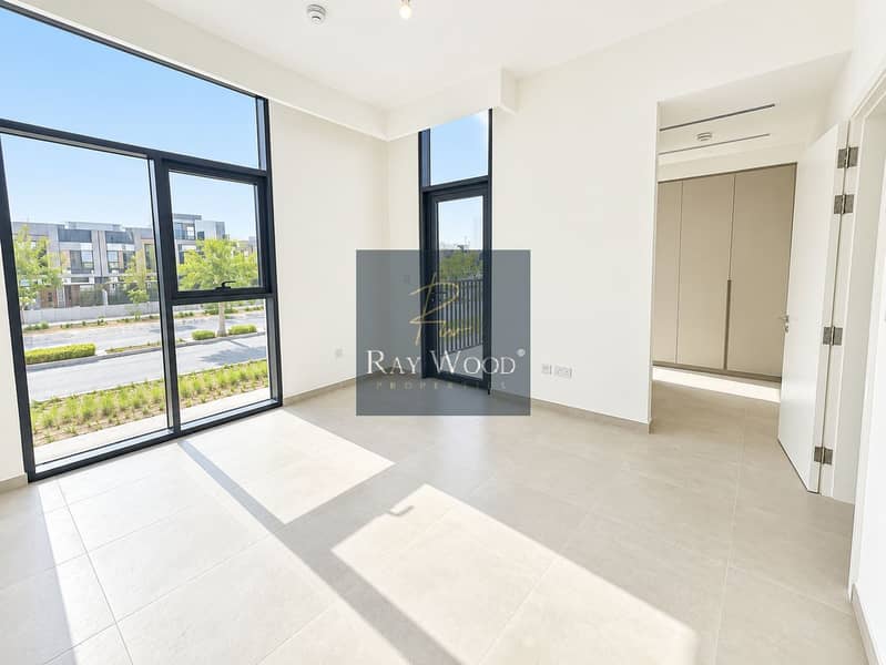 18 Sunlit Minimalist Room with Balcony Views. png