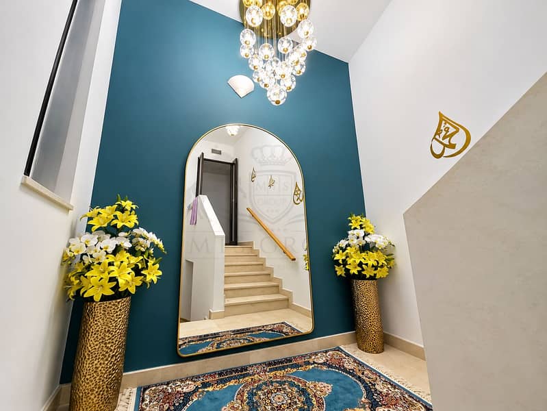 4 Luxurious Teal Entryway with Arched Mirror. png
