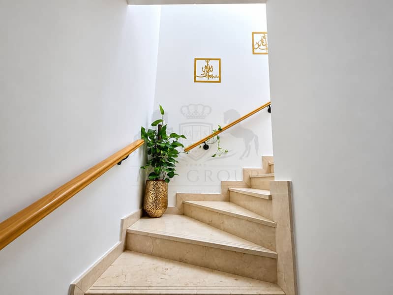 16 Modern Marble Stairwell with Golden Framed Calligraphy - Copy. png