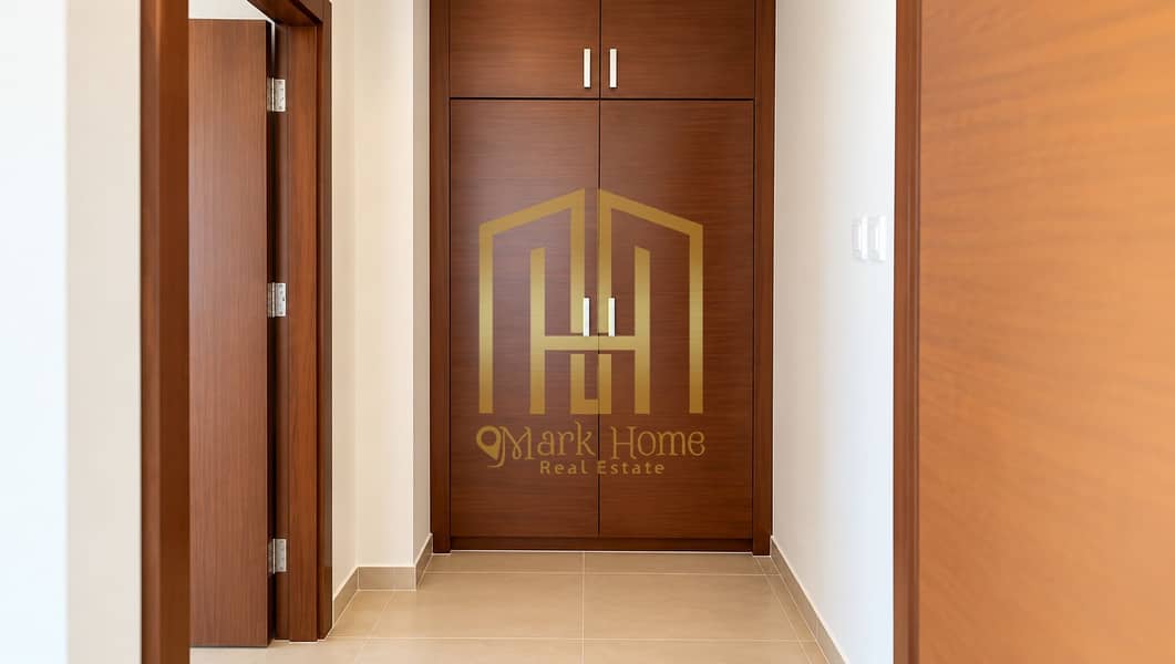 7 Symmetrical Warm Wood Hallway Closet. png