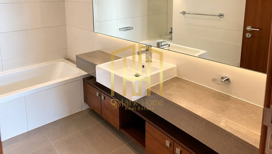 9 Modern Beige Bathroom with Walnut Vanity. png