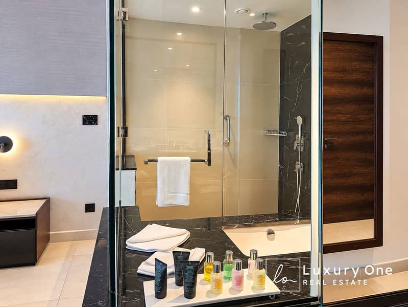5 Luxury Hotel Bathroom with Glass Shower. png
