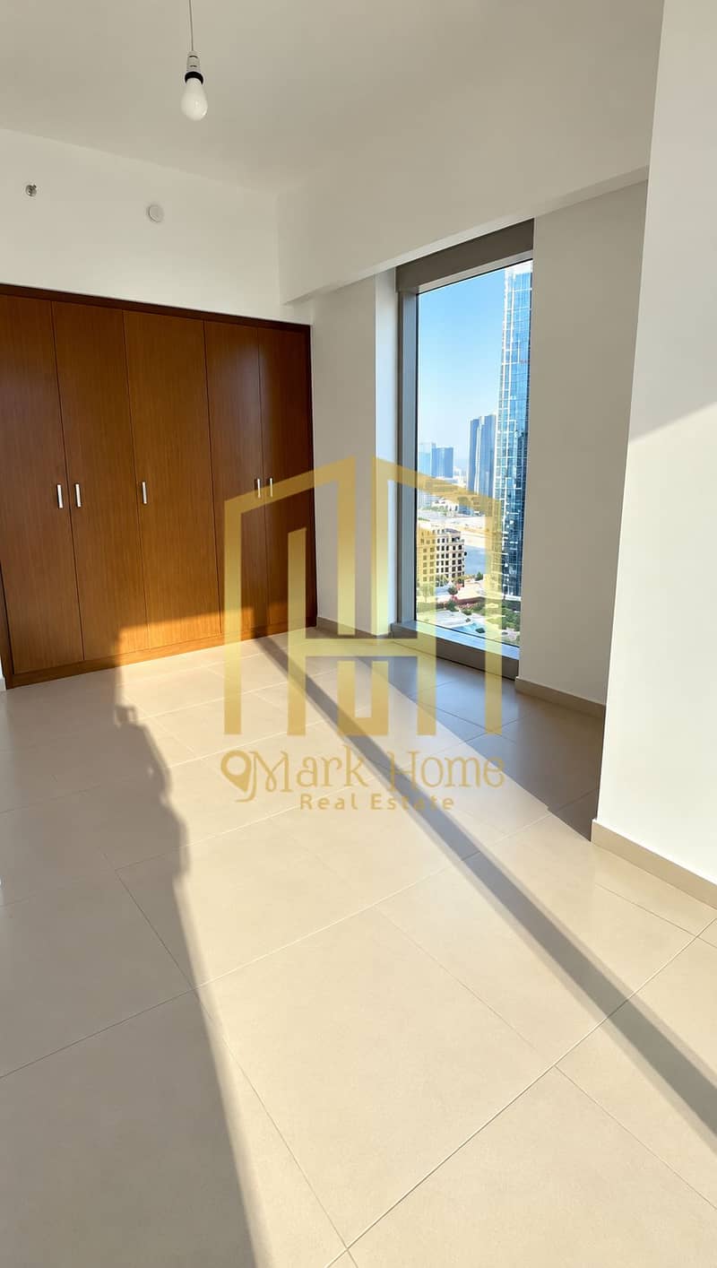 5 Sunlit Minimalist Bedroom with City View. png