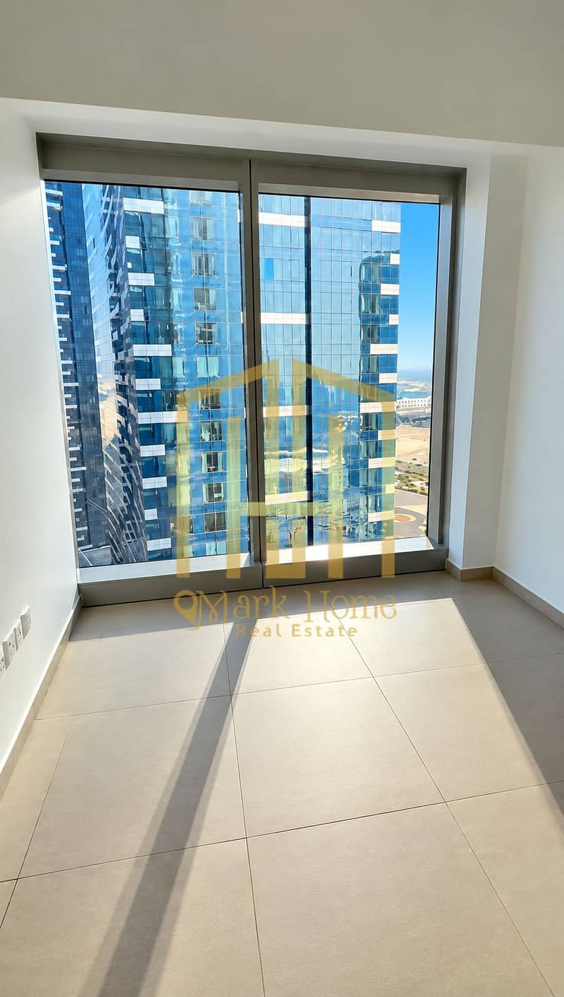 8 Sunlit Interior Overlooking City Towers. png