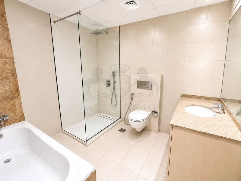 7 Modern Beige Bathroom with Walk-In Shower. png