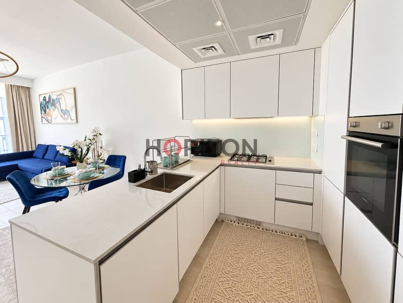 8 Bright Minimalist Kitchen and Blue Living Area. png