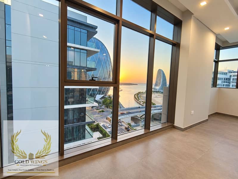 2 Modern Interior Overlooking Waterfront Sunset. png