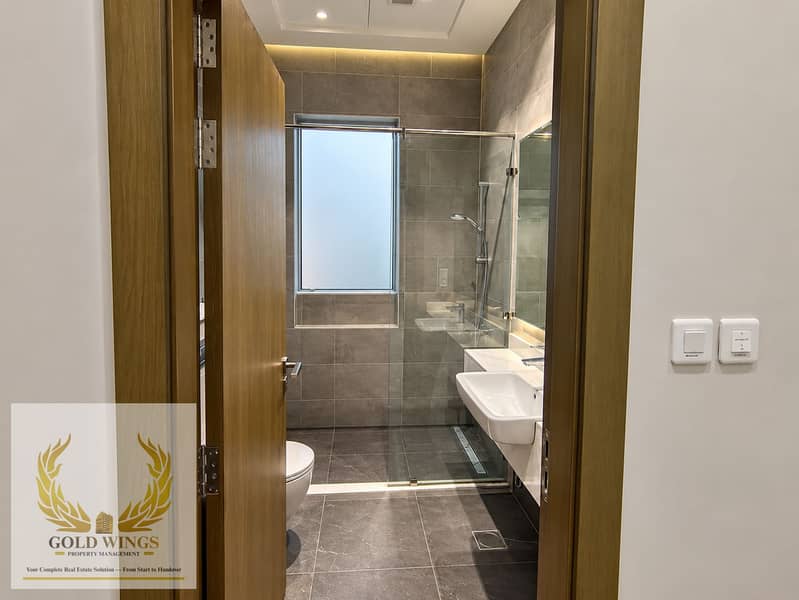 10 Modern Bathroom Through Wooden Door. png