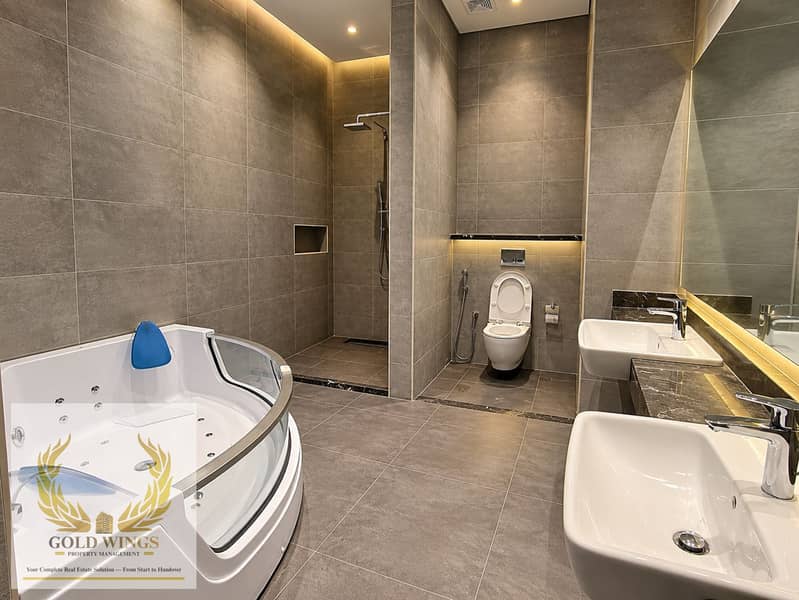 13 Modern Gray Stone Spa Bathroom. png