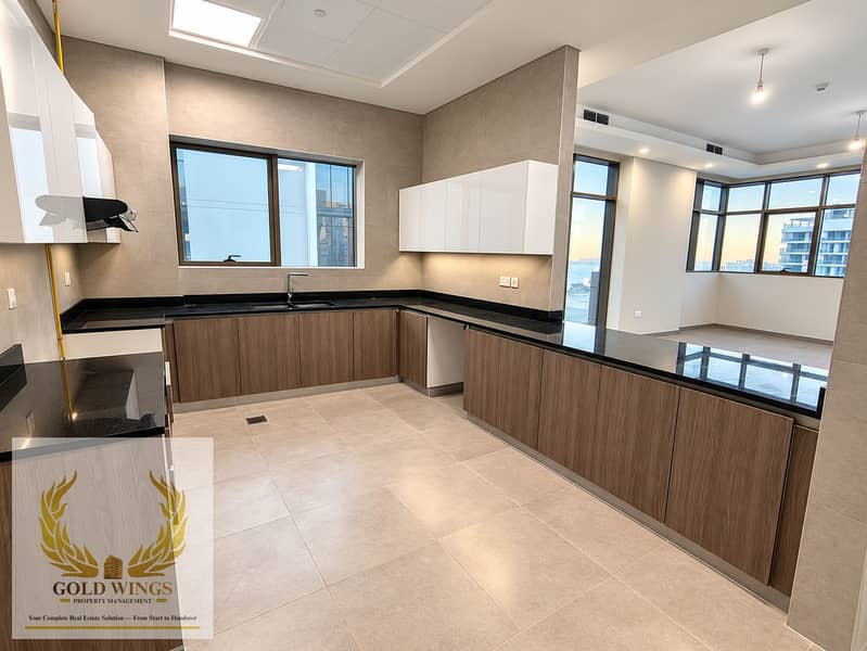 19 Modern U-Shaped Kitchen with City Views. png