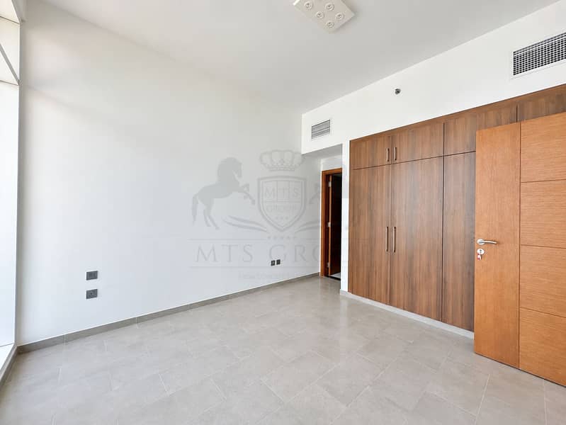 6 Bright Minimalist Room with Wood Wardrobe. png