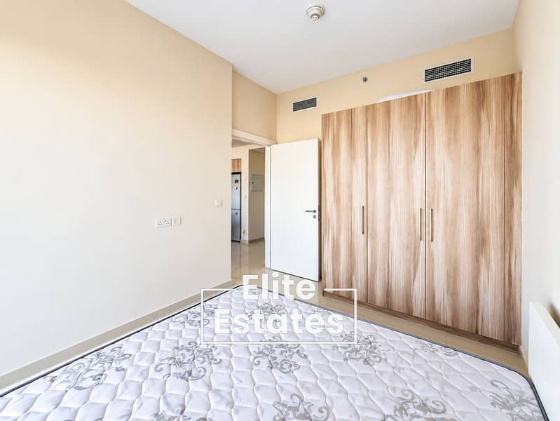 4 Minimal Bedroom with Wardrobe and Open Door. png