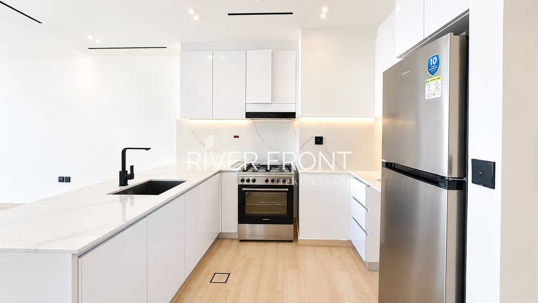 4 Bright Minimalist Kitchen with Marble Accents. jpg