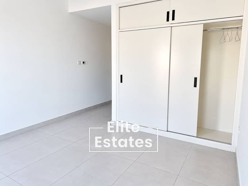 2 Minimalist Bedroom with Open Wardrobe. png
