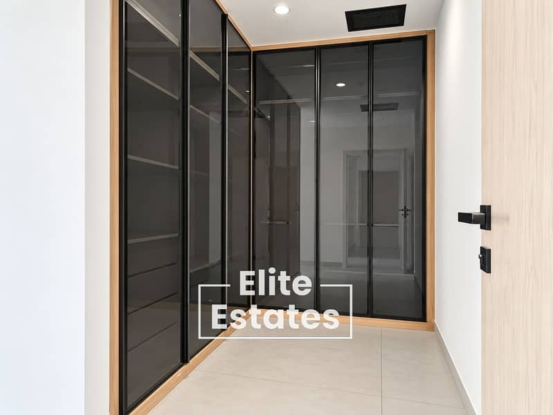 6 Modern Glass-Fronted Walk-In Wardrobe. png