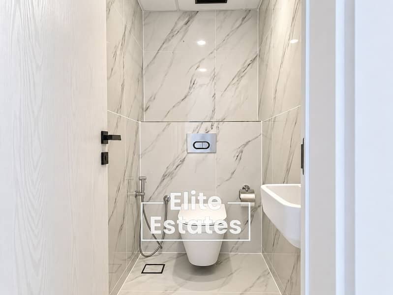 10 Minimalist Marble-Tiled Bathroom. png