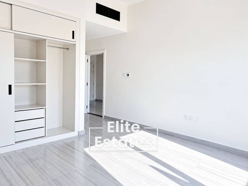 3 Sunlit Minimalist Room with Built-In Wardrobe. png