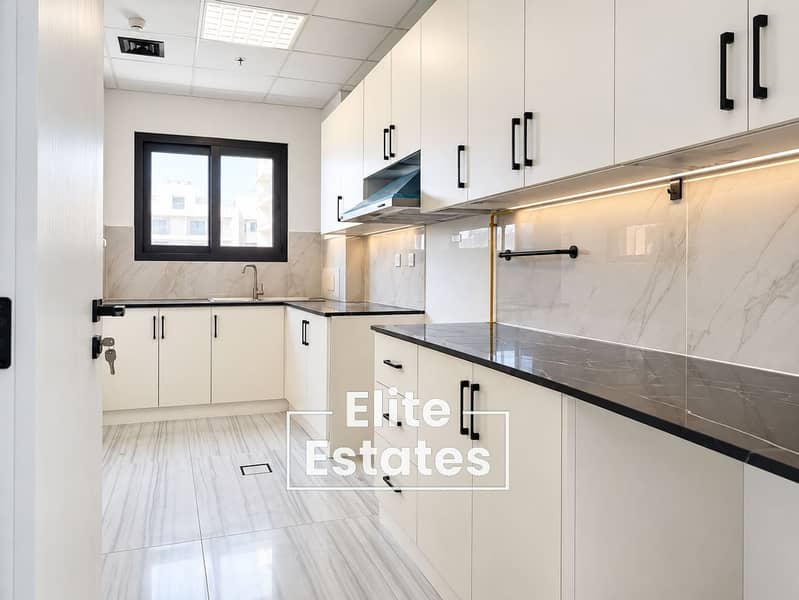 5 Modern White Kitchen with Marble Accents. png