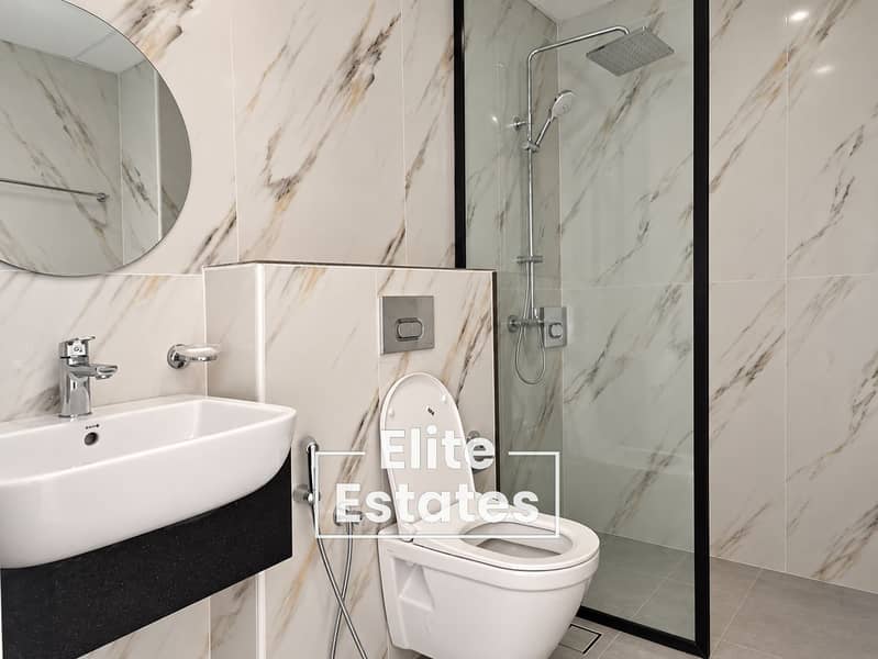 6 Modern Marble Bathroom with Glass Shower. png