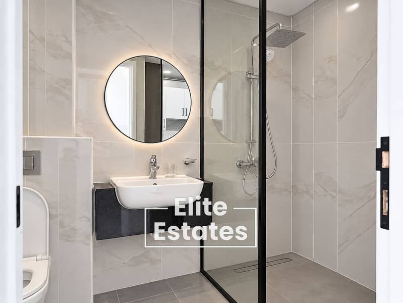 6 Modern Marble-Tiled Bathroom Interior. png