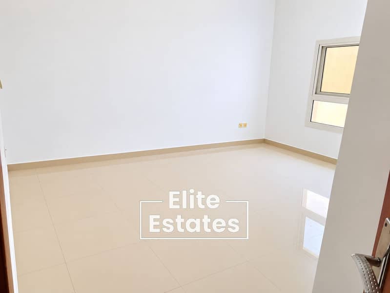 2 Bright Minimalist Room with Glossy Tiles. png