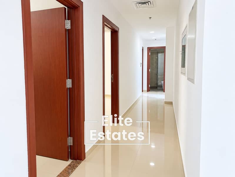 3 Bright Minimalist Hallway with Wooden Doorways. png